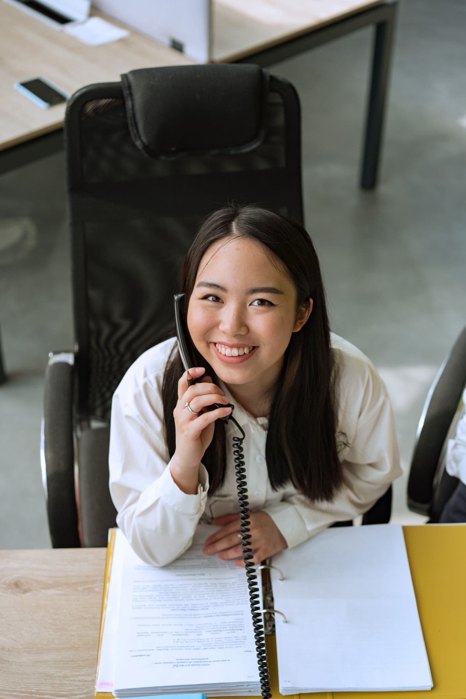 A friendly customer service representative on a phone call